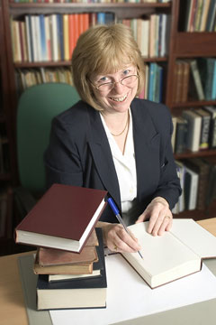 a librarian filing books in a library