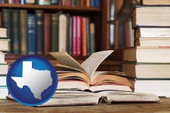 texas map icon and books on a library table and on library bookshelves