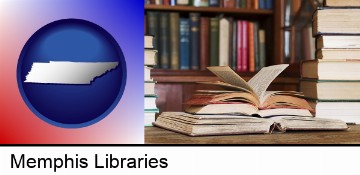 books on a library table and on library bookshelves in Memphis, TN