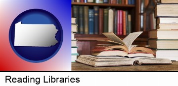 books on a library table and on library bookshelves in Reading, PA