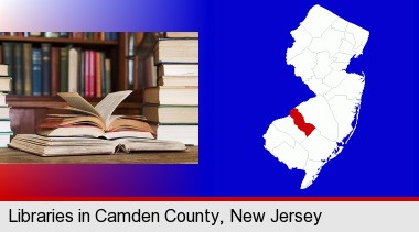 books on a library table and on library bookshelves; Camden County highlighted in red on a map