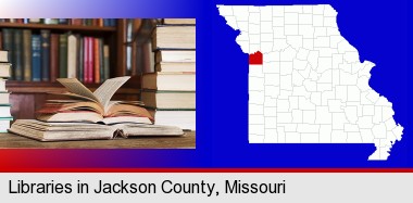 books on a library table and on library bookshelves; Jackson County highlighted in red on a map
