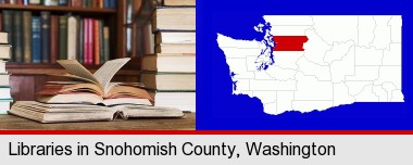 books on a library table and on library bookshelves; Snohomish County highlighted in red on a map
